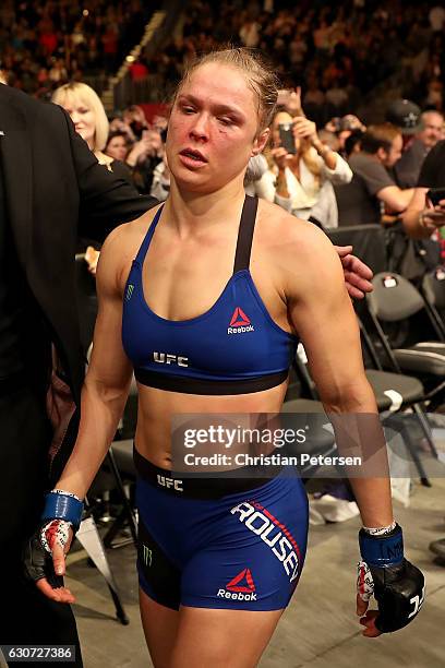 Ronda Rousey exits the Octagon after her loss to Amanda Nunes of Brazil in their UFC women's bantamweight championship bout during the UFC 207 event...