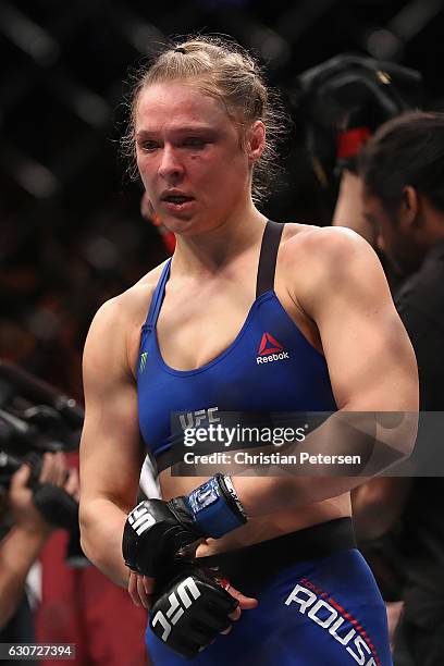 Ronda Rousey exits the Octagon after her loss to Amanda Nunes of Brazil in their UFC women's bantamweight championship bout during the UFC 207 event...