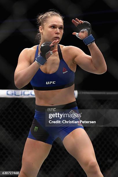 Ronda Rousey faces off against Amanda Nunes of Brazil in their UFC women's bantamweight championship bout during the UFC 207 event at T-Mobile Arena...