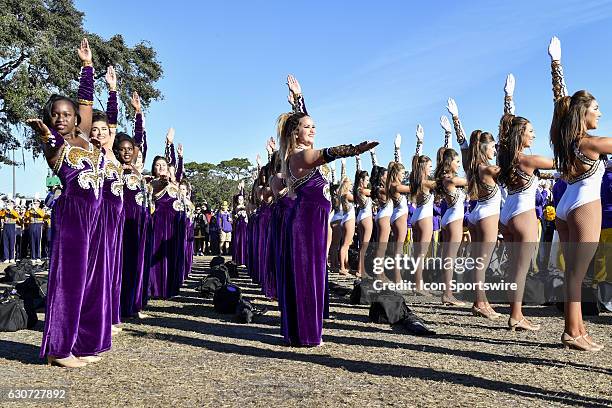 The LSU pep band and cheerleaders perform prior to the start of the Citrus Bowl game between the Louisville Cardinals and the LSU Tigers on December...