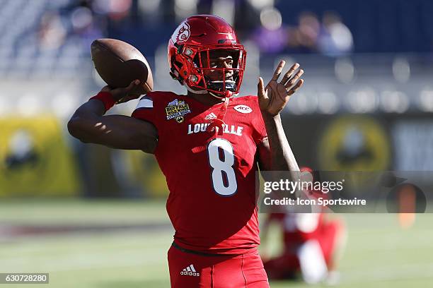 Louisville Cardinals quarterback Lamar Jackson warms up before the 2016 Buffalo Wild Wings Citrus Bowl between the LSU Tigers and Louisville...