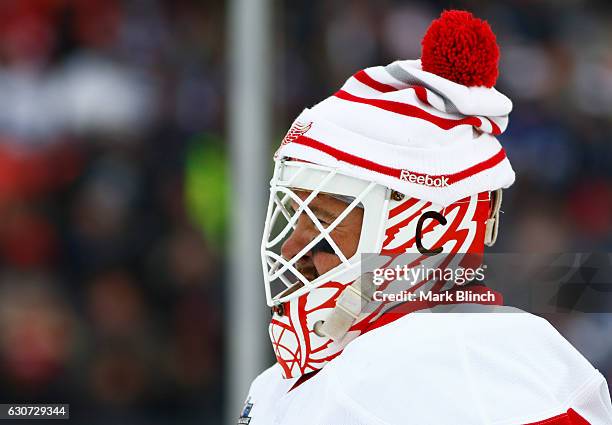 Detroit Red Wings alumni Kevin Hodson stands in the net wearing a toque at the 2017 Rogers NHL Centennial Classic Alumni game between the Detroit Red...