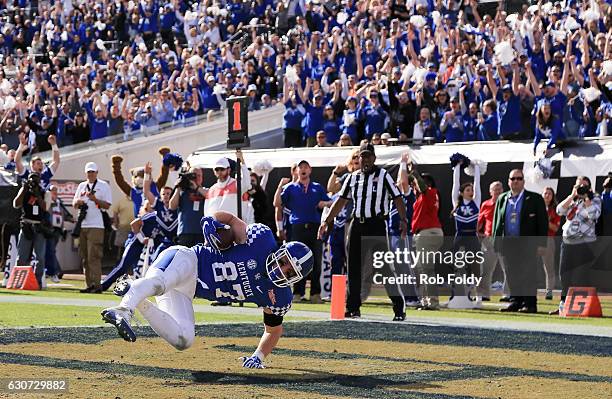 Conrad of the Kentucky Wildcats catches the ball in the end zone for a two-point conversion during the fourth quarter of the game against the Georgia...