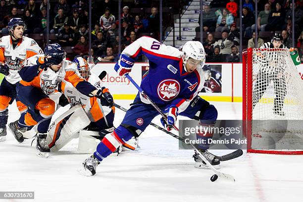 Forward Jeremiah Addison of the Windsor Spitfires moves the puck against the Flint Firebirds on December 31, 2016 at the WFCU Centre in Windsor,...