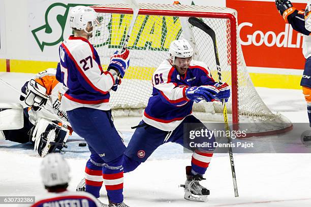 Forward Luke Boka of the Windsor Spitfires celebrates his goal against the Flint Firebirds on December 31, 2016 at the WFCU Centre in Windsor,...