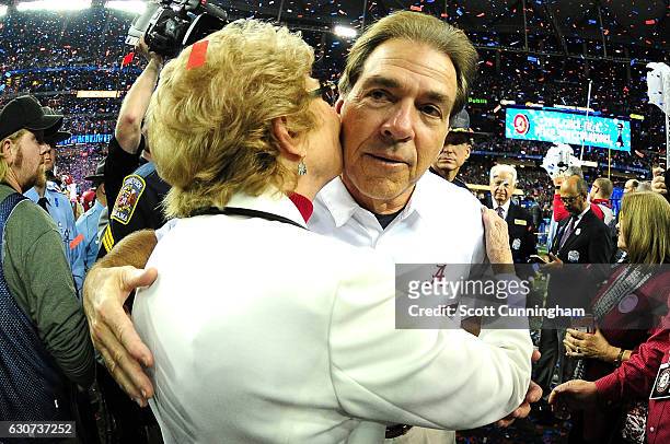 Head Coach Nick Saban celebrates with his mother Mary Saban after winning 24 to 7 against the Washington Huskies during the 2016 Chick-fil-A Peach...