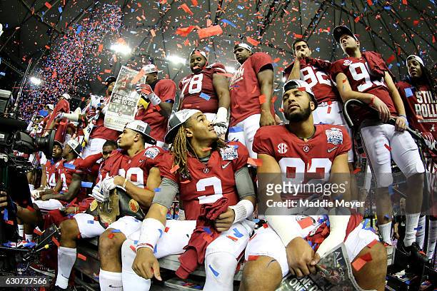 Jalen Hurts of the Alabama Crimson Tide celebrates with his teammates after winning 24 to 7 against Washington Huskies during the 2016 Chick-fil-A...