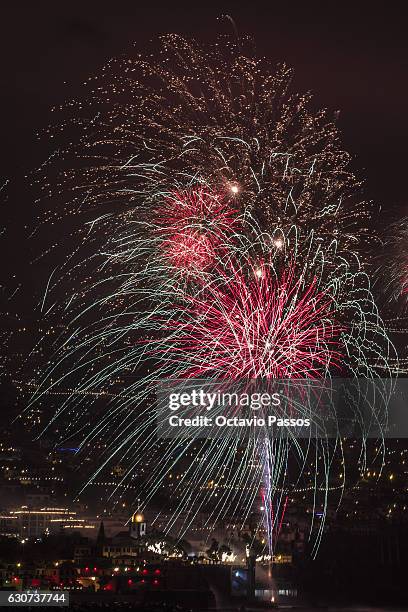 Fireworks light up the sky above Funchal Bay, Madeira Island, to celebrate the arrival of the New Year on January 1, 2017 in Funchal, Madeira,...