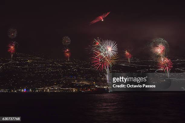 Fireworks light up the sky above Funchal Bay, Madeira Island, to celebrate the arrival of the New Year on January 1, 2017 in Funchal, Madeira,...