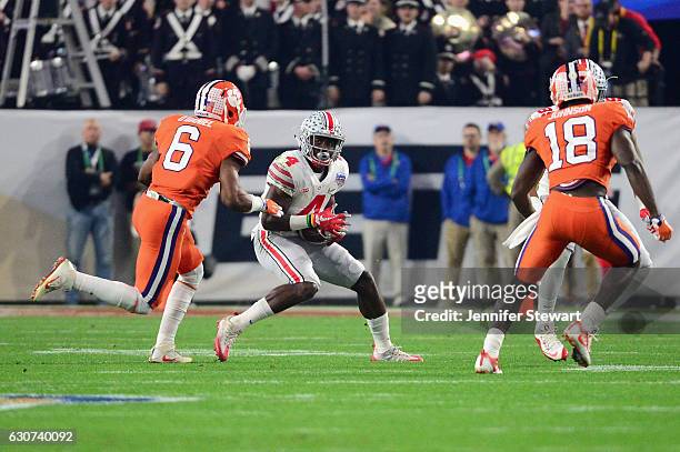 Curtis Samuel of the Ohio State Buckeyes past Dorian O'Daniel of the Clemson Tigers during the first half of the 2016 PlayStation Fiesta Bowl at...