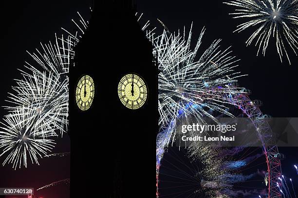 Fireworks light up the London skyline and Big Ben just after midnight on January 1, 2017 in London, England. Thousands of people lined the banks of...