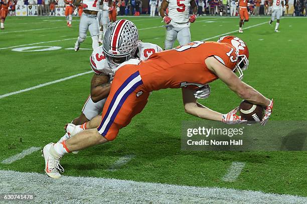 Hunter Renfrow of the Clemson Tigers is hit by Damon Arnette of the Ohio State Buckeyes during the first half of the 2016 PlayStation Fiesta Bowl at...