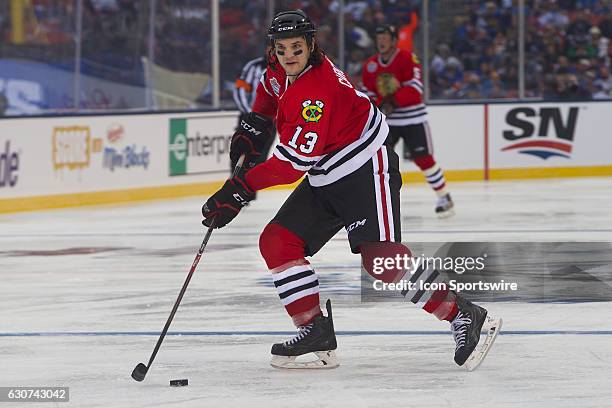 Chicago Blackhawks Forward Daniel Carcillo skates with the puck during a NHL Winter Classic Alumni hockey game between the St. Louis Blues and the...