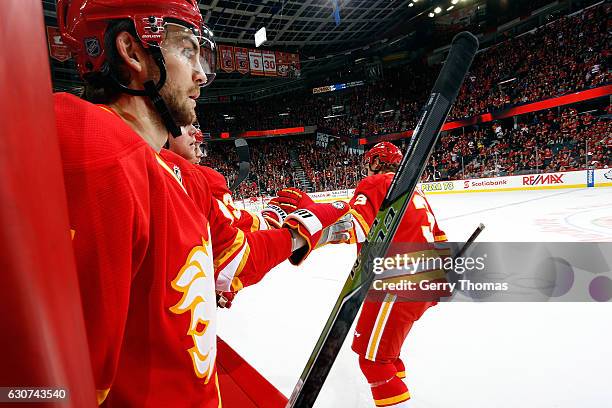 Michael Frolik and Jyrki Jokipakka of the Calgary Flames celebrate a goal against the Arizona Coyotes during an NHL game on December 31, 2016 at the...