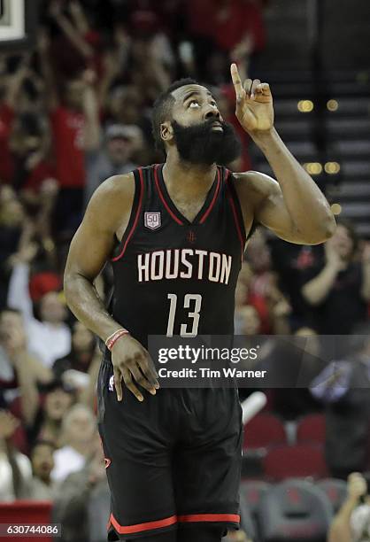 James Harden of the Houston Rockets celebrates a three point shot in the second half against the New York Knicks at Toyota Center on December 31,...