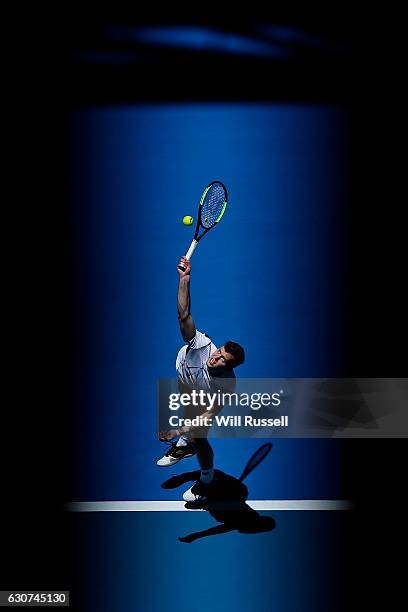 Adam Pavlasek of the Czech Republic serves to Jack Sock of the United States during their match on day one of the 2017 Hopman Cup at Perth Arena on...