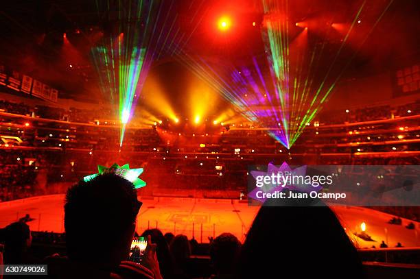 Kings fans watch the Fourth Annual Holiday Pyrotechnic and Laser Light Show following the game between the Los Angeles Kings and the San Jose Sharks...