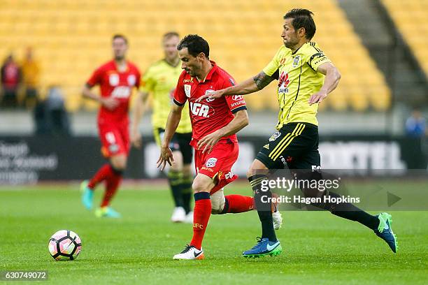 Sergio Cirio of Adelaide United evades the defence of Vince Lia of the Phoenix during the round 13 A-League match between Wellington Phoenix and...