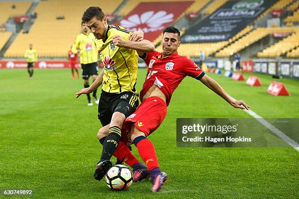 Jacob Tratt of the Phoenix and Sergio Guardiola of Adelaide United compete for the ball during the round 13 A-League match between Wellington Phoenix...