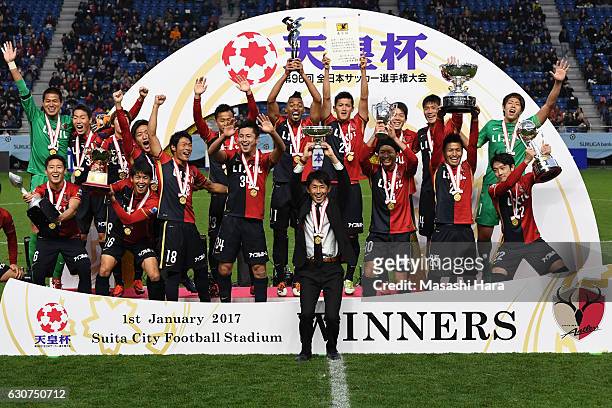 Masatada Ishii of Kashima Antlers lifts the Cup after the 96th Emperor's Cup final match between Kashima Antlers and Kawasaki Frontale at Suita City...