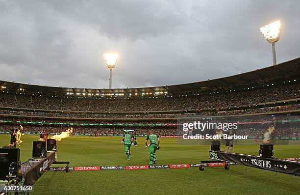 Luke Wright and Glenn Maxwell of the Stars walk out to bat during the Big Bash League match between the Melbourne Stars and Melbourne Renegades at...
