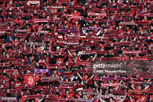 Supporters of Kashima Antlers hold mufflers prior to the 96th Emperor's Cup final match between Kashima Antlers and Kawasaki Frontale at Suita City...