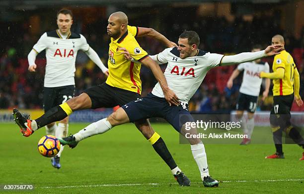 Younes Kaboul of Watford and Vincent Janssen of Tottenham Hotspur battle for the ball during the Premier League match between Watford and Tottenham...