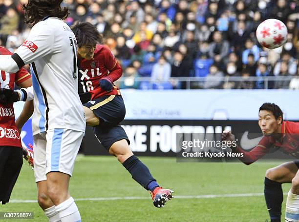 Shuto Yamamoto of Kashima Antlers heads his team into a 42nd-minute lead against Kawasaki Frontale in the Emperor's Cup final at Suita Stadium in...