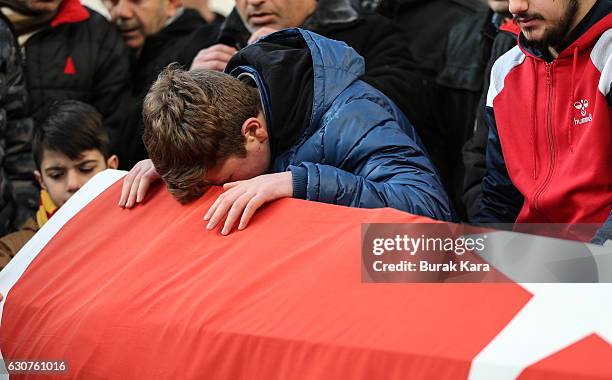 Relatives and friends mourn at a coffin during the funeral of Ayhan Arik, one of the 39 victims of the gun attack on the Reina, a popular night club...