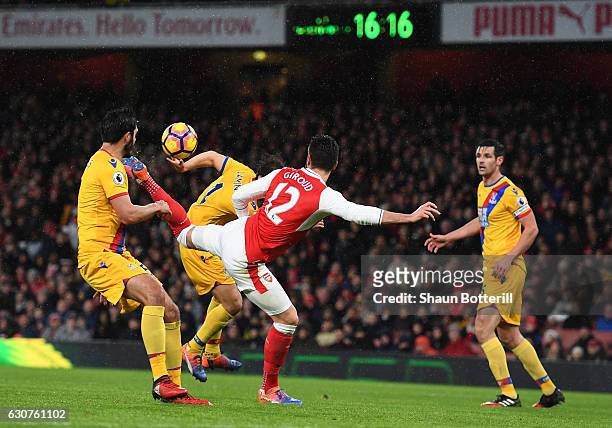 Olivier Giroud of Arsenal scores the opening goal during the Premier League match between Arsenal and Crystal Palace at the Emirates Stadium on...