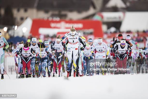 Stina Nilsson of Sweden and Ingvild Flugstad Oestberg of Norway competes during the women's 5 km C mass start race on January 1, 2017 in Val Mustair,...