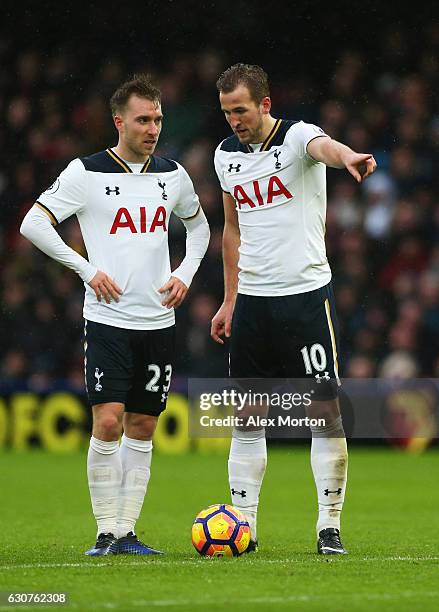 Harry Kane and Christian Eriksen of Tottenham Hotspur line up a free kick during the Premier League match between Watford and Tottenham Hotspur at...