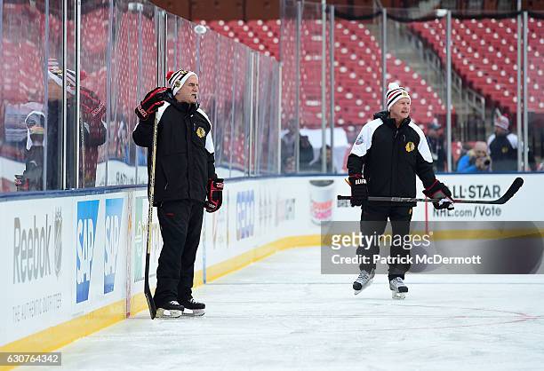 Head coach Joel Quenneville, left, and assistant coach Mike Kitchen of the Chicago Blackhawks look on during practice for the 2017 Bridgestone NHL...