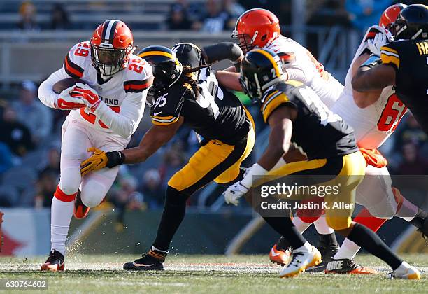 Duke Johnson of the Cleveland Browns rushes against the Pittsburgh Steelers in the first half during the game at Heinz Field on January 1, 2017 in...