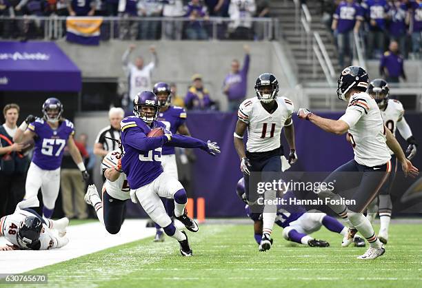 Marcus Sherels of the Minnesota Vikings carries the ball for a 36 yard punt return in the second quarter of the game against the Chicago Bears on...