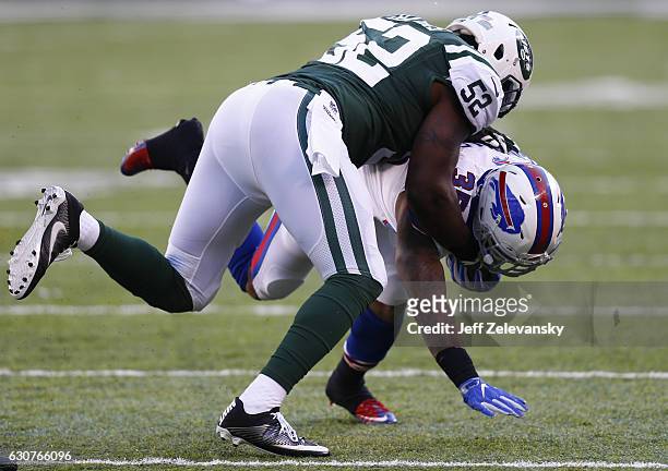 David Harris of the New York Jets tackles Mike Gillislee of the Buffalo Bills at MetLife Stadium on January 1, 2017 in East Rutherford, New Jersey.