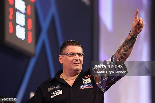 Gary Anderson of Great Britain celebrates beating Peter Wright of Great Britain in their semi-final match on day fourteen of the 2017 William Hill...