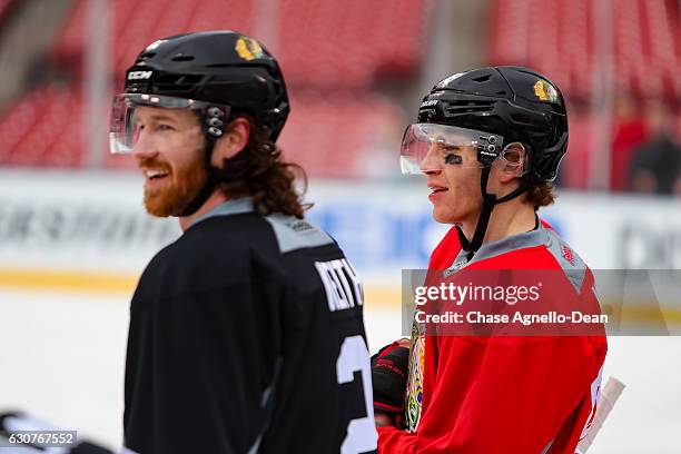 Patrick Kane of the Chicago Blackhawks stands with Duncan Keith during the 2017 Bridgestone NHL Winter Classic Practice Day at Busch Stadium on...