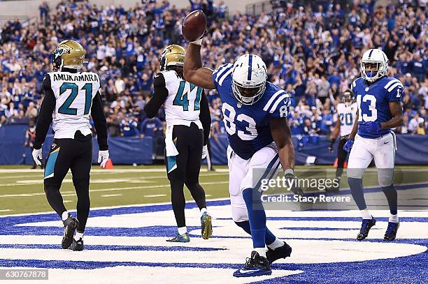 Dwayne Allen of the Indianapolis Colts celebrates a touchdown during the second half of a game against the Jacksonville Jaguars at Lucas Oil Stadium...