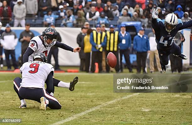 Antwon Blake of the Tennessee Titans dives attempting to block an extra point by Nick Novak of the Houston Texans during the second half at Nissan...