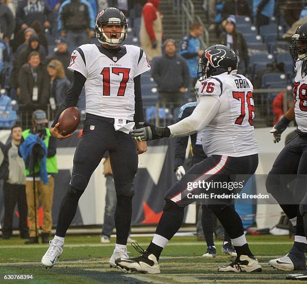 Quarterback Brock Osweiler of the Houston Texans reacts after making a rushing touchdown against of the Tennessee Titans during the second half at...