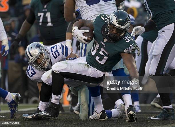 Terrell Watson of the Philadelphia Eagles runs past Mark Nzeocha of the Dallas Cowboys to score a touchdown in the fourth quarter at Lincoln...