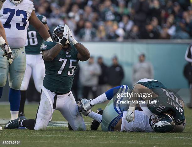 Vinny Curry of the Philadelphia Eagles reacts after he and Connor Barwin sack Mark Sanchez of the Dallas Cowboys in the third quarter at Lincoln...