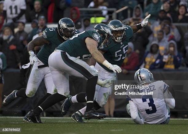 Vinny Curry, Connor Barwin, and Brandon Graham of the Philadelphia Eagles chase after and sack Mark Sanchez of the Dallas Cowboys in the fourth...