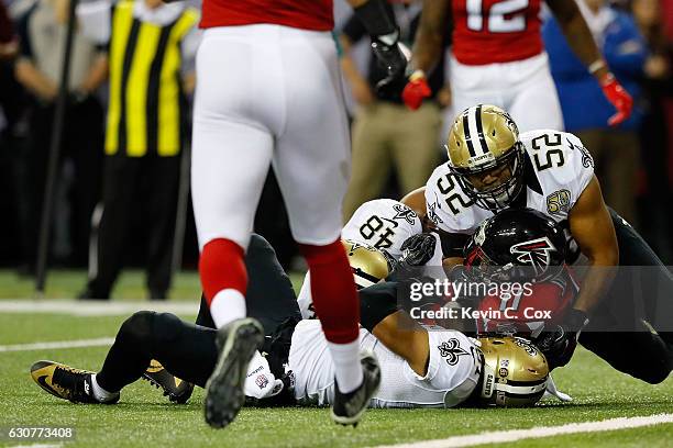 Julio Jones of the Atlanta Falcons is tackled short of the goal line by Craig Robertson, Vonn Bell and Jairus Byrd of the New Orleans Saints during...