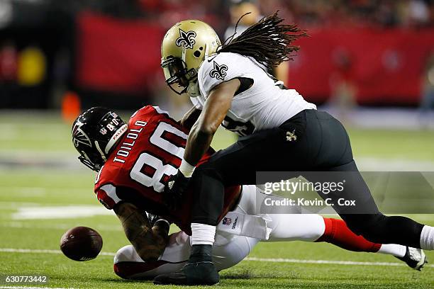 Dannell Ellerbe of the New Orleans Saints breaks up a pass intended for Levine Toilolo of the Atlanta Falcons during the first half at the Georgia...