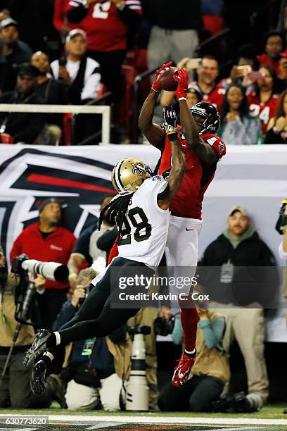 Julio Jones of the Atlanta Falcons catches a touchdown over B.W. Webb of the New Orleans Saints during the first half at the Georgia Dome on January...