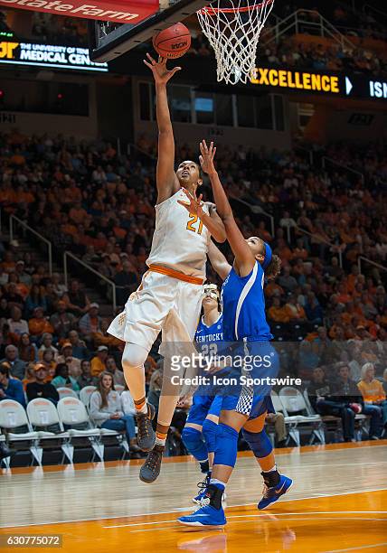 Tennessee Lady Volunteers center Mercedes Russell drives past Kentucky Wildcats center Alyssa Rice for a lay up during a game between the Tennessee...