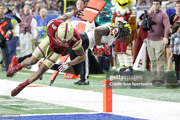 Boston College Eagles defensive back John Johnson knocks Maryland Terrapins running back Wes Brown out of bound short of the goal line during Quick...