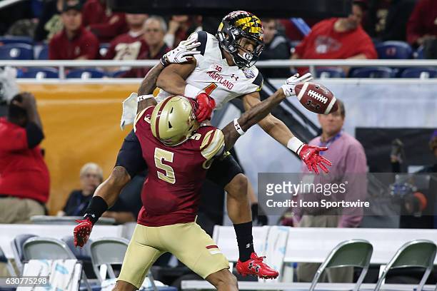 Maryland Terrapins wide receiver D.J. Moore attempts to catch a pass against Boston College Eagles defensive back Kamrin Moore during Quick Lane Bowl...